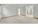Large bedroom with neutral carpet, trim, and multiple doorways to other rooms at 10369 E Red Mtn, Littleton, CO 80127