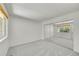 Neutral bedroom with carpet, built in mirror doors, and a large window at 10369 E Red Mtn, Littleton, CO 80127