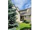 Charming two-story home with a well-manicured lawn, beautiful landscaping, and welcoming front entrance at 10369 E Red Mtn, Littleton, CO 80127