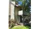 Exterior view of a multi-story home featuring a balcony and covered patio area at 10369 E Red Mtn, Littleton, CO 80127