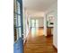 Inviting foyer with hardwood floors leads to an open living space with sliding doors to the deck at 10369 E Red Mtn, Littleton, CO 80127