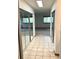 Bright hallway with tile flooring, double mirrored closets, and leading to bedrooms at 10369 E Red Mtn, Littleton, CO 80127