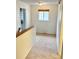 Upper hallway featuring neutral carpet, natural light, and doors leading to rooms at 10369 E Red Mtn, Littleton, CO 80127
