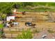 Equestrian facility with horses in a fenced paddock, showcasing the property's potential for animal lovers at 10369 E Red Mtn, Littleton, CO 80127