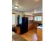 Spacious kitchen features an integrated desk area, granite countertops, and modern appliances at 10369 E Red Mtn, Littleton, CO 80127