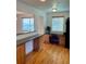 Open kitchen with desk area, wood cabinets and granite countertops at 10369 E Red Mtn, Littleton, CO 80127