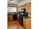 Updated kitchen features solid countertops and modern black appliances at 10369 E Red Mtn, Littleton, CO 80127