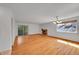 Bright living room with hardwood floors, fireplace, and sliding glass door at 10369 E Red Mtn, Littleton, CO 80127