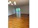 Spacious living room has hardwood floors, fireplace, and sliding glass doors leading to a private deck at 10369 E Red Mtn, Littleton, CO 80127
