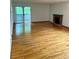 Bright living room featuring a fireplace and sliding doors to the outdoor deck at 10369 E Red Mtn, Littleton, CO 80127