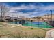 Well-maintained tennis courts offer recreational opportunities with a beautiful mountain view and green surroundings at 10369 E Red Mtn, Littleton, CO 80127