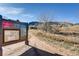 Entrance to a trail with signage, inviting outdoor adventures with scenic mountain views and open space at 10369 E Red Mtn, Littleton, CO 80127