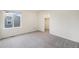 Bright bedroom with carpeted floors, window, and neutral walls at 26267 E 3Rd Ave, Aurora, CO 80018