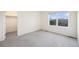 Bright bedroom with closet and window, carpeted floor and neutral walls at 26267 E 3Rd Ave, Aurora, CO 80018