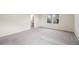 Spacious bedroom with neutral carpet and a view to the ensuite bathroom at 26267 E 3Rd Ave, Aurora, CO 80018