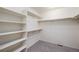Walk-in closet with shelving and clothing rods, providing ample storage space at 26267 E 3Rd Ave, Aurora, CO 80018