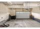 Spacious two car garage with room for storage and a white garage door at 26267 E 3Rd Ave, Aurora, CO 80018