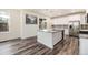 Kitchen island with granite countertop and stainless steel appliances at 26267 E 3Rd Ave, Aurora, CO 80018