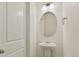 A pedestal sink highlights a bright, clean and modern powder room at 4107 Marble Dr, Mead, CO 80504