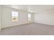 Bright bedroom features new carpet, neutral colors, and multiple windows at 4107 Marble Dr, Mead, CO 80504