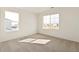 Bright bedroom with two large windows, neutral carpet and great natural light at 4107 Marble Dr, Mead, CO 80504