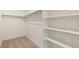 Spacious walk-in closet with built-in shelves and hanging rods offering ample storage space at 4107 Marble Dr, Mead, CO 80504