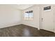 Clean, empty room with light gray flooring, white walls, and natural light at 4107 Marble Dr, Mead, CO 80504