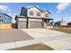 Charming two-story home featuring a spacious driveway and a partially landscaped front yard at 4107 Marble Dr, Mead, CO 80504