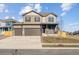 Charming two-story home with a covered front porch, three car garage, and neutral paint at 4107 Marble Dr, Mead, CO 80504