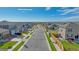 Street view of new construction homes in a Primary planned community near a lake at 4107 Marble Dr, Mead, CO 80504