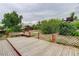 A beautiful backyard featuring a wooden deck surrounded by lush landscaping at 9743 W 67Th Pl, Arvada, CO 80004