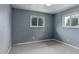 Unfurnished bedroom with natural light, featuring two windows and neutral carpeting at 9743 W 67Th Pl, Arvada, CO 80004