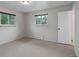 Bedroom with two windows providing natural light, neutral carpet, and closet door. Ready for personalization at 9743 W 67Th Pl, Arvada, CO 80004
