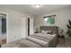 Well-lit bedroom with a comfortable bed, closet space, and contemporary lamps creating a relaxing ambiance at 9743 W 67Th Pl, Arvada, CO 80004