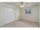 Bedroom featuring a ceiling fan, window, and a closet with bi-fold doors at 9743 W 67Th Pl, Arvada, CO 80004