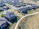 Aerial view of a community with well-maintained homes, walking paths, and green spaces at 21972 E Allenspark Dr, Aurora, CO 80016