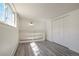 Bright bedroom with updated flooring, built-in shelves, and closet at 2724 S Ames Way, Denver, CO 80227