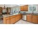 Spacious kitchen featuring granite countertops, stainless steel appliances, and tile flooring at 2724 S Ames Way, Denver, CO 80227