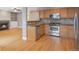 Stylish kitchen open to the living room featuring stainless steel appliances and granite counters at 4453 W Mountain Vista Ln, Castle Rock, CO 80109