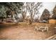 Large backyard featuring a birdhouse and wood fire pit at 4263 S Elati St, Englewood, CO 80110