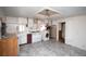 Spacious kitchen featuring lots of storage, appliances, and access to the laundry area at 4263 S Elati St, Englewood, CO 80110