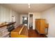 Living room featuring a fireplace with a view to the kitchen and bathroom at 4263 S Elati St, Englewood, CO 80110