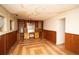 Retro living room with custom built-in cabinets, drawers, and a desk area, plus patterned floor at 4263 S Elati St, Englewood, CO 80110