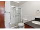 Bright bathroom featuring a glass enclosed shower, vanity and a toilet at 615 S Alton Way # 7A, Denver, CO 80247