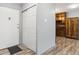 View of the entryway with wood-style flooring, coat closet and access to the kitchen at 615 S Alton Way # 7A, Denver, CO 80247