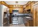 Updated kitchen with stainless steel appliances, stylish backsplash, and sleek countertops at 615 S Alton Way # 7A, Denver, CO 80247