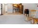 View of the living room leading into the kitchen with stainless steel appliances at 615 S Alton Way # 7A, Denver, CO 80247