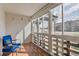 Bright sunroom with a chair, multiple windows, and views of the surrounding landscape at 615 S Alton Way # 7A, Denver, CO 80247
