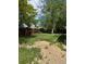 Backyard with overgrown grass and wooden fence at 14425 E Albrook Dr, Denver, CO 80239