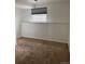 Neutral basement with carpet flooring and a window at 14425 E Albrook Dr, Denver, CO 80239